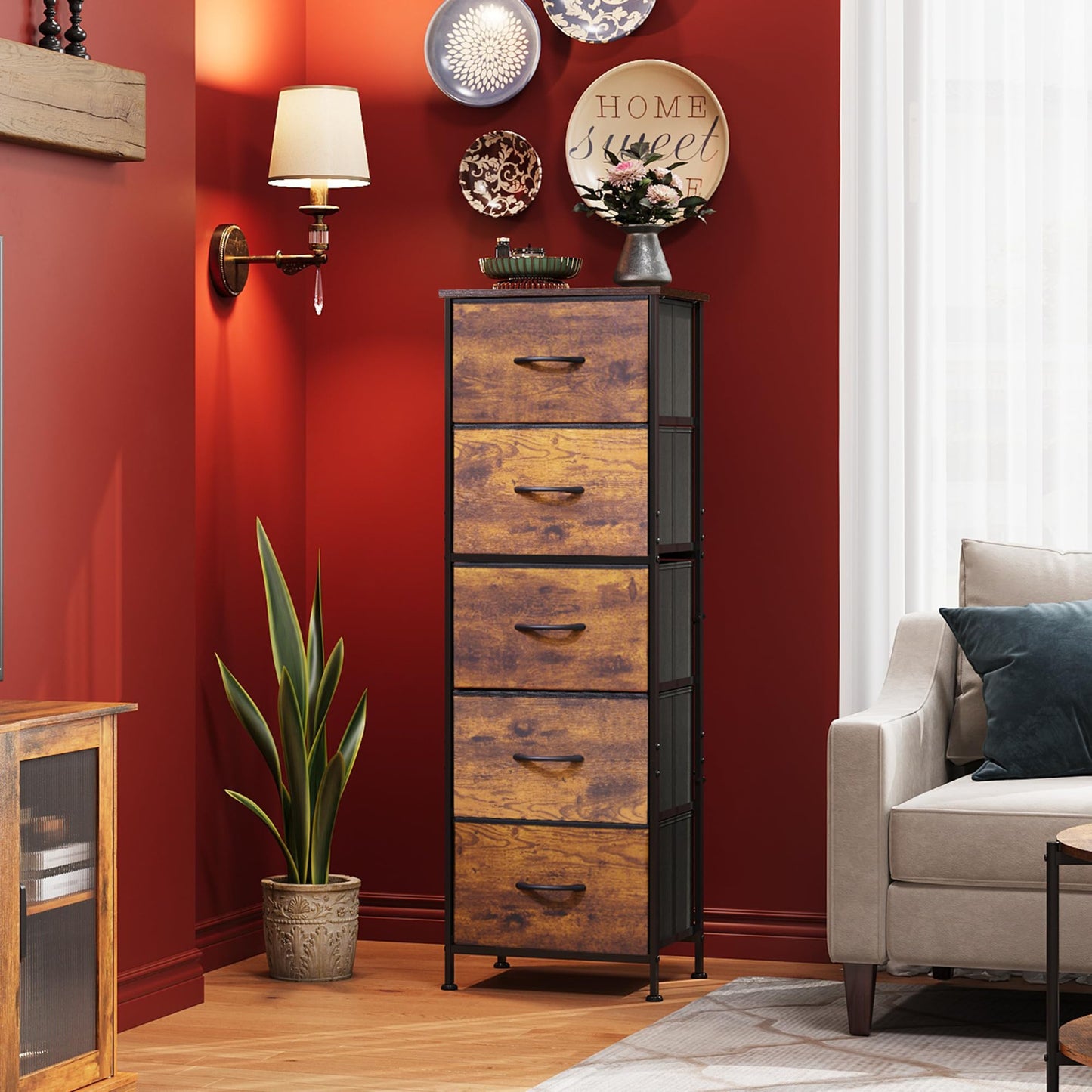 Wooden dresser against a red wall with decorative items in a living room setting.