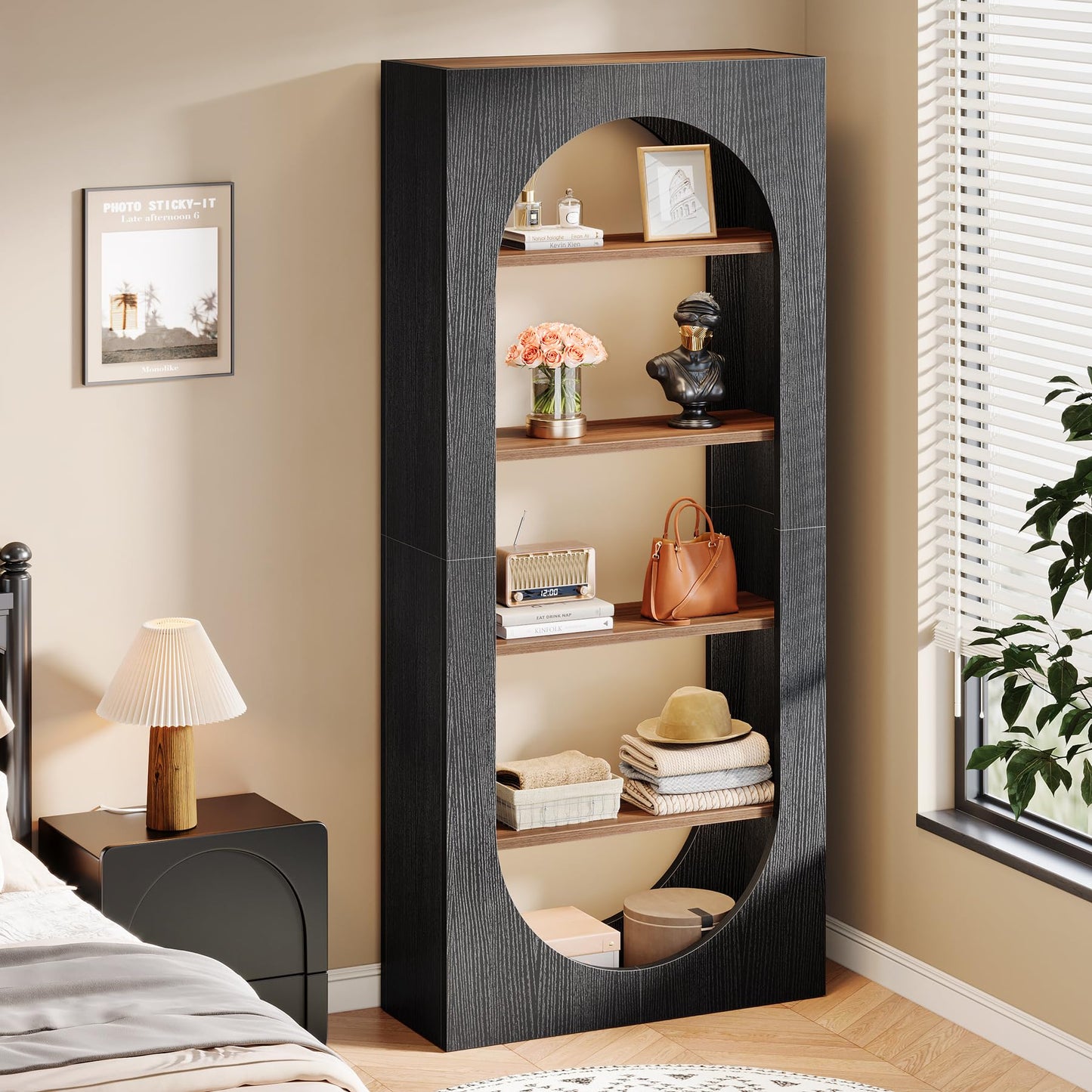 Tall black bookshelf with decorative items in a bedroom setting