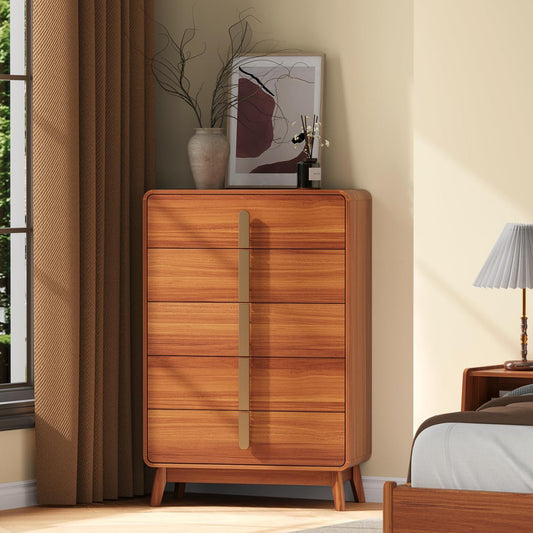 Wooden dresser in a bedroom setting with a lamp and decor items.