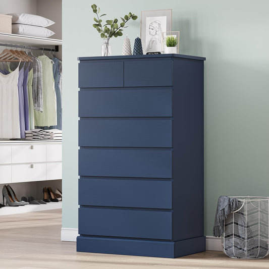 Blue dresser in a room with a wardrobe and laundry basket.