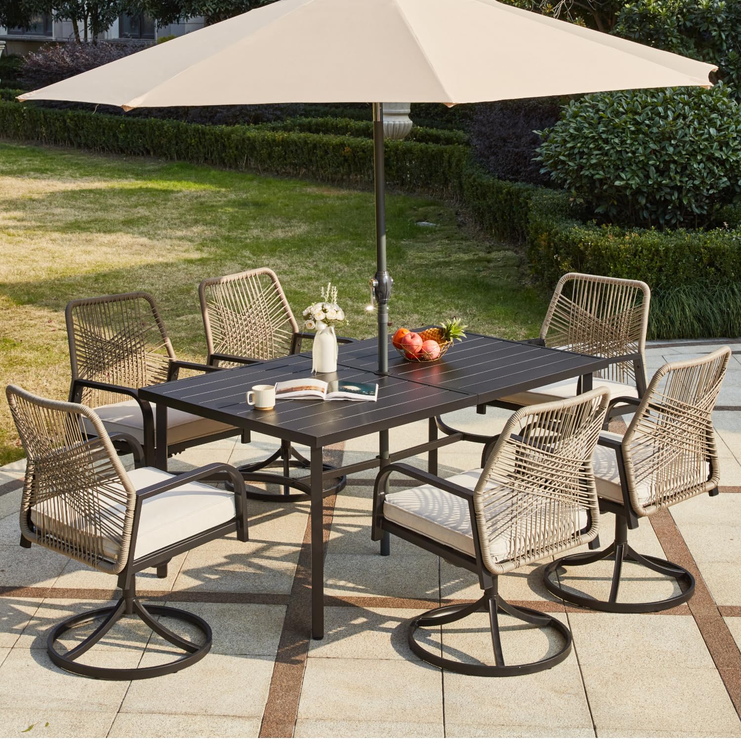 Outdoor dining set with table and chairs under a large umbrella on a patio.