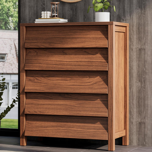 Wooden dresser with five drawers against a wooden wall.