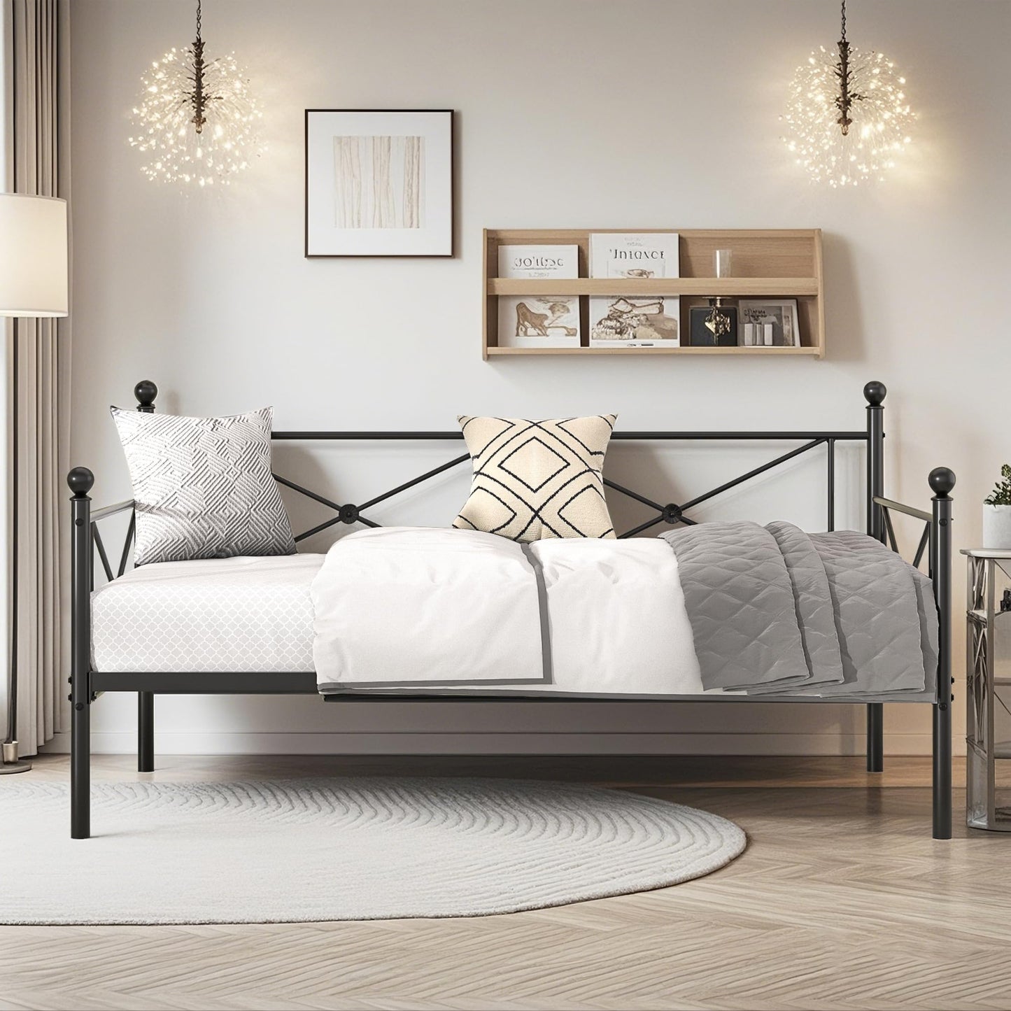 Bedroom with a metal bed frame, pillows, and a shelf on the wall.