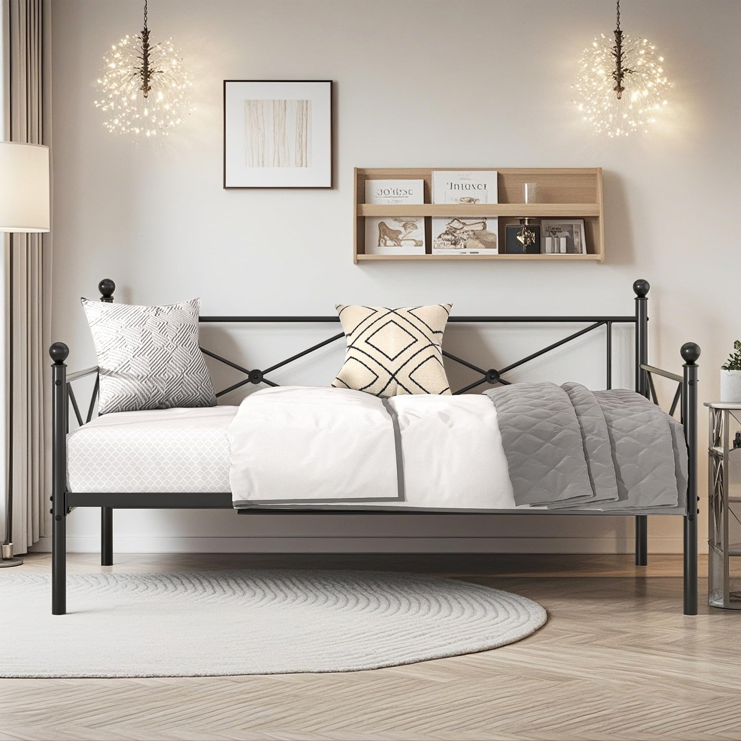 Bedroom with a metal bed frame, pillows, and a shelf on the wall.